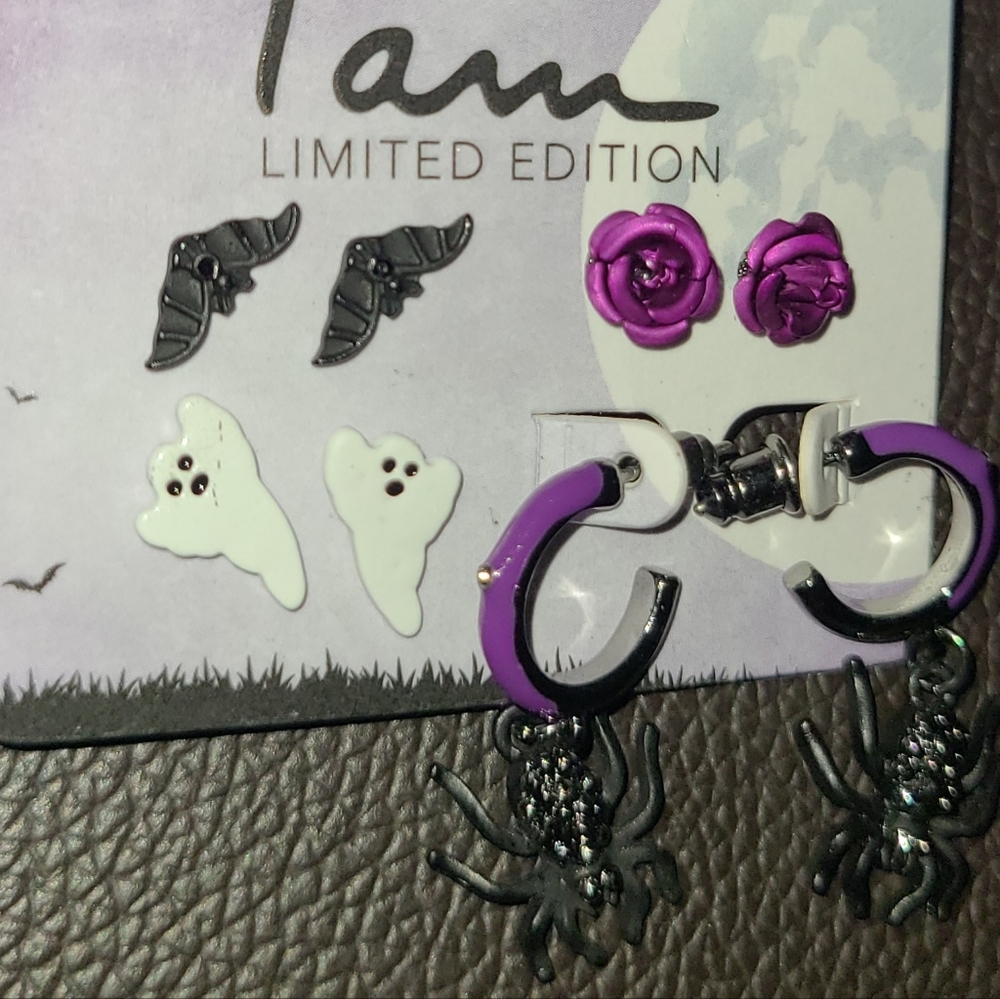 4 PAIRS OF EARRINGS BY CLAIRE'S PURPLE ROSE BAT GHOST SPIDER EARRINGS.